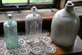 James O'Neill's stoneware whiskey jug & liquor bottles at Monte Cristo Cottage. New London, CT.