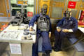 Crew mess with models wearing Emergency Air Breathing Apparatus in USS Nautilus at Submarine Force Museum. Groton, CT.
