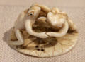 Japanese ivory Netsuke of two frogs wrestling on lotus leaf at Yale University Art Gallery. New Haven, CT.