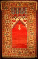 Prayer rug with vine border from Lâdik, Konya province, south central Anatolia at Textile Museum. Washington, DC
