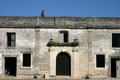 Spanish conquistador patrols Castillo de San Marcos walls. St Augustine, FL.