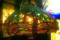 Signed Tiffany stained glass lamp with bronze at Lightner Museum. St Augustine, FL.