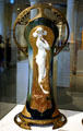 French porcelain Art Nouveau vase with Ormolu mounts showing draped woman by Charles Korschmann at Lightner Museum. St Augustine, FL.