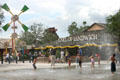 Visitors enjoy fountains at Downtown Disney. Disney World, FL.