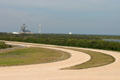 Crawler road with launch pad in distance at Kennedy Space Center. FL.