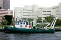 Broward County Jail over working boat on New River. Fort Lauderdale, FL.