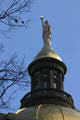 Woman with sword & flame on Georgia State House dome cupola. Atlanta, GA.