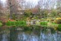 Pond reflects gardens of Jimmy Carter Presidential Museum. Atlanta, GA.