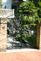 Modern gate with Magnolia theme by East Wayne Iron Works above Calhoun Square. Savannah, GA.