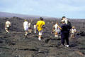 Hikers on lava in Volcanoes National Park. Big Island of Hawaii, HI.