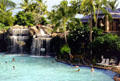 Water falls into swimming pool at Hilton Waikoloa Village, Kona coast. Big Island of Hawaii, HI.