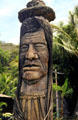 Wood carving of Maui Pohaku at roadside on northern coast of Oahu. Oahu, HI.