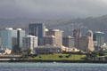 View of downtown Honolulu centered on Federal Building from off the coast. Honolulu, HI.