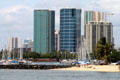 Hokua , round Nauru , & 1350 Ala Moana Towers over Waikiki yacht harbor. Honolulu, HI.