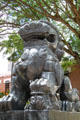 Chinese stone female lion with cub in Dr. Sun Yat-sen Memorial Park at entrance to Chinatown area of Honolulu. Honolulu, HI