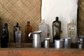 Antique glass bottles & tinware in Oldest Frame House of Mission House Museum. Honolulu, HI.