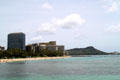 Trump International Hotel & Tower Waikiki Beach Walk with Diamond Head beyond. Waikiki, HI.