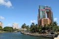 Ala Wai canal & Waikiki Landmark building. Waikiki, HI.