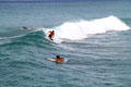 Surfers off Waikiki Beach. Waikiki, HI.