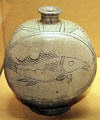 Korean stoneware wine bottle inscribed with fish with celadon glaze at Honolulu Academy of Arts. Honolulu, HI