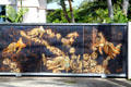 Artistic gate with golden carp for home east of Waikiki. Honolulu, HI.