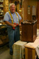 Craftsman with hand-made furniture of Amana Colony at Krauss Furniture Factory. South Amana, IA.