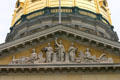 Sculpted pediment of Iowa State Capitol with allegorical figures including locomotive. Des Moines, IA.