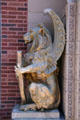 Lion griffin beside door of Merchants' National Bank. Grinnell, IA.
