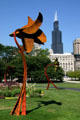 Sculpted steel flowers in Grant Park seen against Sears Tower. Chicago, IL.