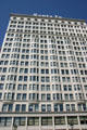 White terra cotta facade with bay windows of Santa Fe Building. Chicago, IL.