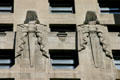 Two Babylonian-themed sculpted guards with swords carved on InterContinental Chicago building. Chicago, IL.