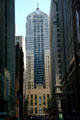 Chicago Board of Trade towers at end of an urban canyon. Chicago, IL.