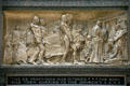 Bronze relief of a Catholic funeral with native Americans "The de Profundis was intoned The body was then carried to the church" on Marquette Building. Chicago, IL.