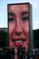 A thousand photos of faces from all ethnic groups are projected sequentially on the Crown Fountain Towers which contain arrays of LED screens in Millennium Park. Chicago, IL.