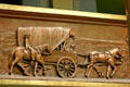Relief of horse-drawn wagon going west in Illinois State Capitol. Springfield, IL.
