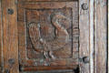 Coq carved on door of lit-clos cabinet bed in Old French House. Vincennes, IN.