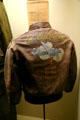 WW II US Army bomber jacket hand-painted with bomber dropping bombs at Eisenhower Museum. Abilene, KS.