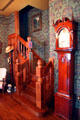 Reception room stairway & tall clock by John Samuel Krause in recreated Wichita Cottage at Sedgwick County Historical Museum. Wichita, KS.