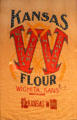 Kansas flour sack sent as relief to German-occupied Belgium in WW I & returned embroidered by grateful Belgians at Sedgwick County Historical Museum. Wichita, KS.