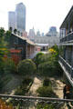 View of downtown New Orleans over courtyard garden of Hermann Grima House. New Orleans, LA.
