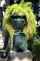 Cast iron planter urn at "Our Mother of Perpetual Help Chapel" house in Garden District. New Orleans, LA.