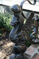 Cast iron winged beast on stair railing outside Van Benthuysen-Elms Mansion. New Orleans, LA.