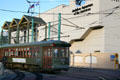 New Orleans streetcar runs past Aquarium of the Americas. New Orleans, LA.