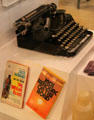 Lowell native Jack Kerouac typewriter & books at Boott Cotton Mills Boarding House immigrant gallery. Lowell, MA.