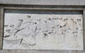 Relief carving of Pilgrims' landing at Plymouth Rock on National Forefathers Monument. Plymouth, MA.