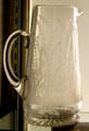 Engraved pitcher by Joseph Henry Lapham of Boston & Sandwich Glass Co. at Sandwich Glass Museum. Sandwich, MA.