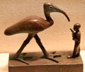 Ancient Egyptian bronze statuette of Ibis & priest at Museum of Fine Arts. Boston, MA.