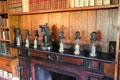 Collection of busts on fireplace mantle in Stone Library at Peacefield. Quincy, MA.