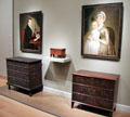 Painted chests of drawers under portraits by William Jennys at Museum of Fine Arts. Boston, MA.