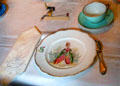 Dining room place setting with hand-painted plate at Gibson House Museum. Boston, MA.